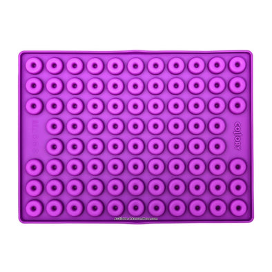 Purple Collory silicone baking mat for making doughnut-shaped homemade dog treats